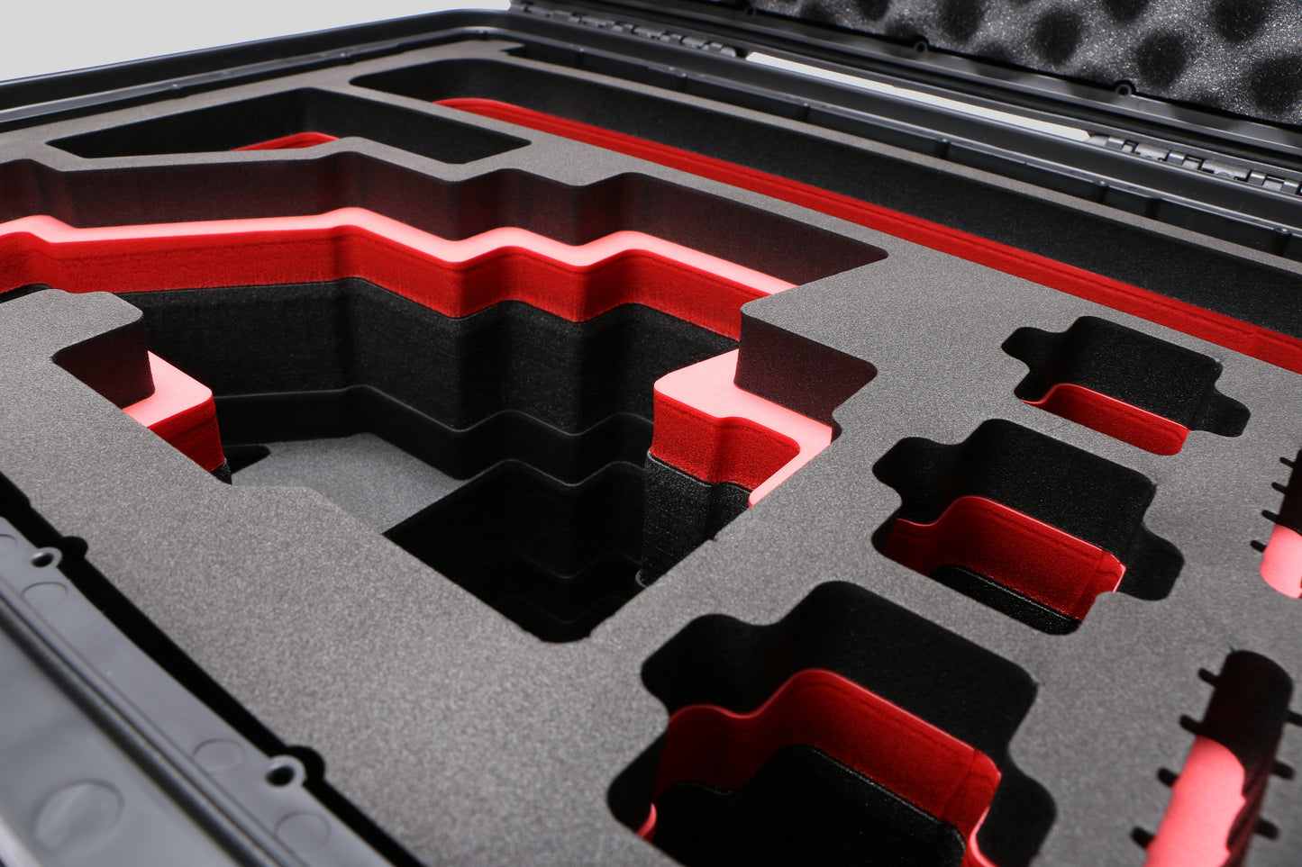 Close-up view 1 of Sony FX6 Black Color Studio Case and Custom Foam Insert with a Red Layer