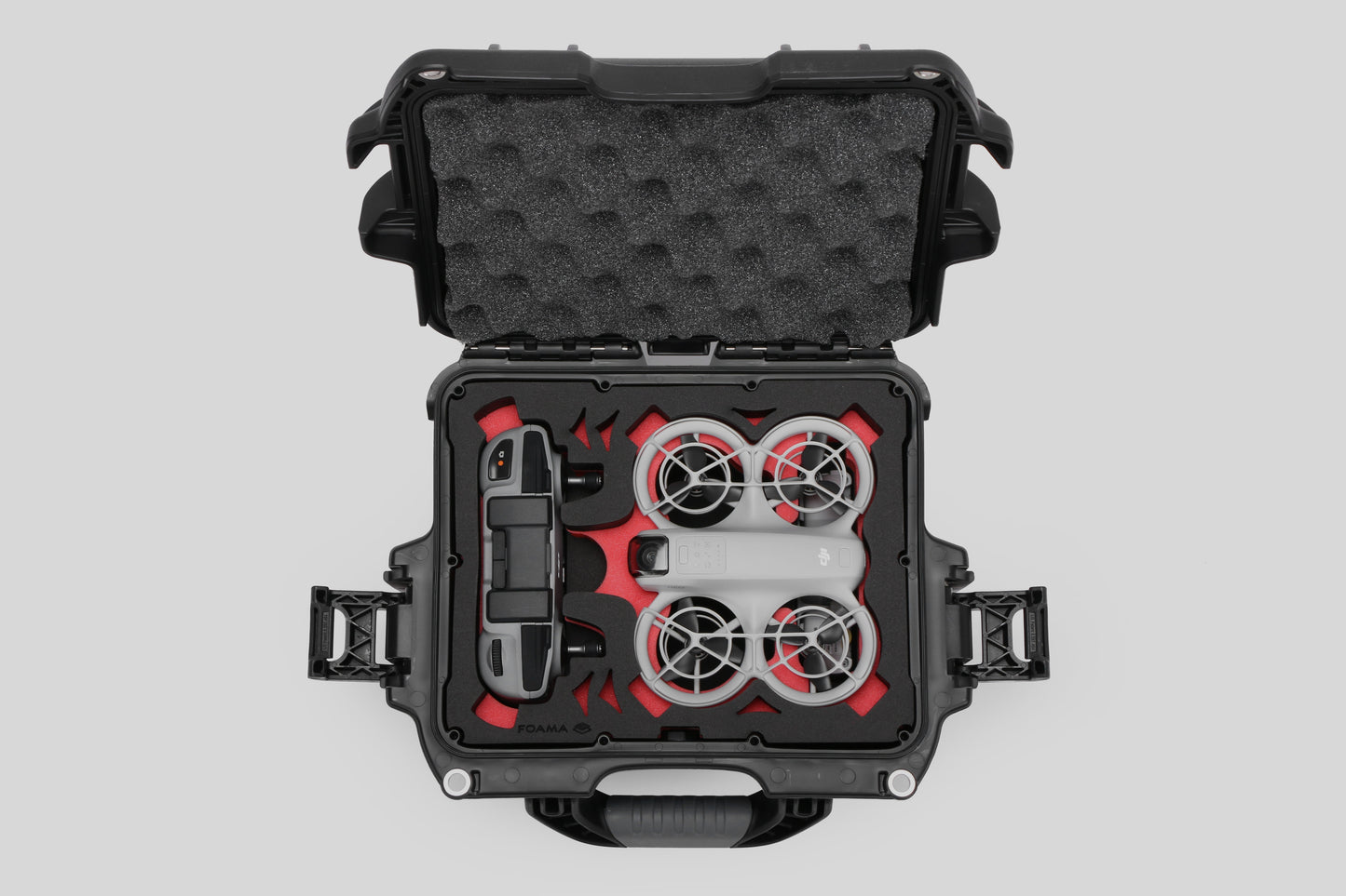 Top view of DJI Neo Black Color Adventure Ready Compact Waterproof Carry-on Case and Custom Foam Insert with a Red Layer, holding the DJI Neo Combo
