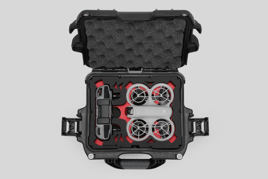 Top view of DJI Neo Black Color Adventure Ready Compact Waterproof Carry-on Case and Custom Foam Insert with a Red Layer, holding the DJI Neo Combo