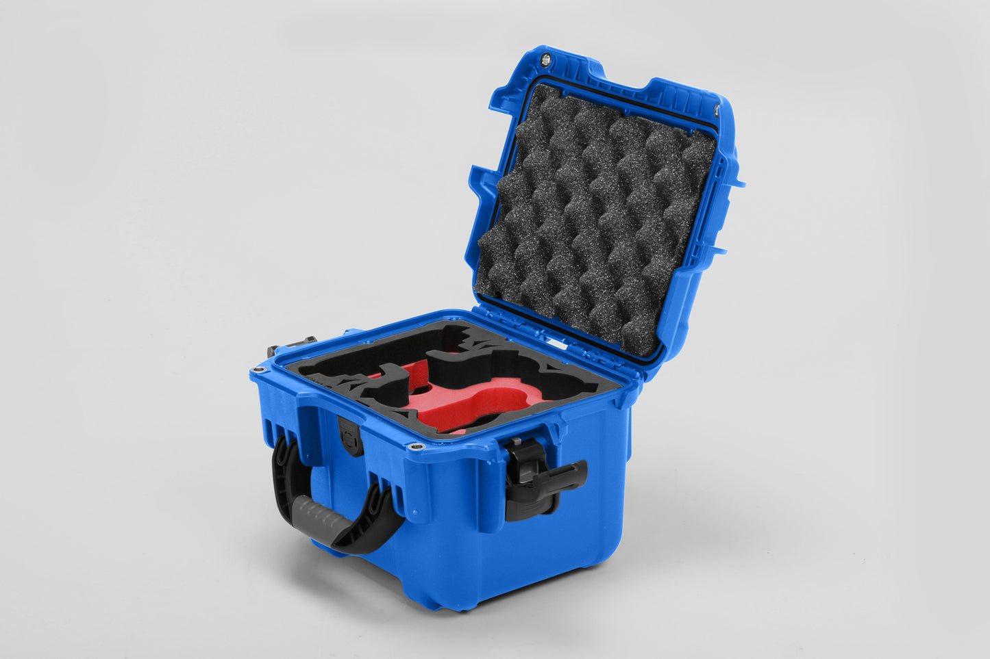 Angled view of DJI Neo Blue Color Adventure Ready Compact Waterproof Carry-on Case and Custom Foam Insert with a Red Layer for DJI Neo