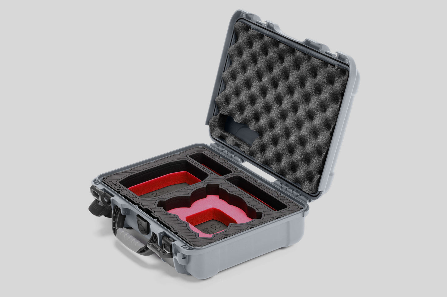 Angled view of Foama Silver Color All-Weather Carry-on Case and Custom Foam Insert with a Red Layer for DJI Neo