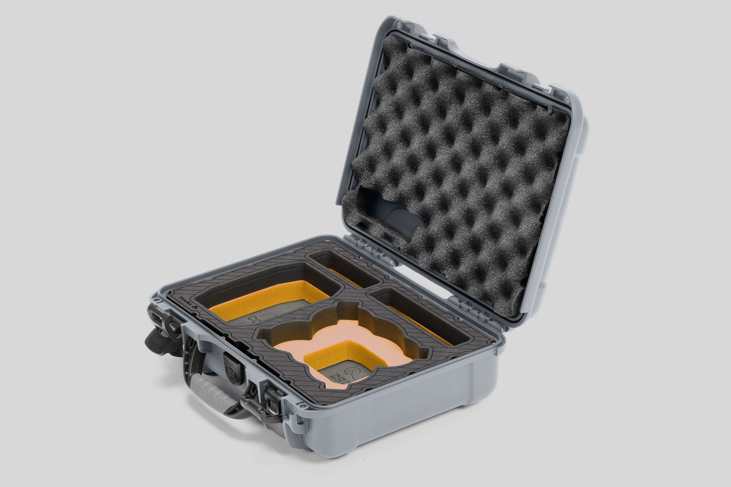 Angled view of Foama Silver Color All-Weather Carry-on Case and Custom Foam Insert with a Yellow Layer for DJI Neo
