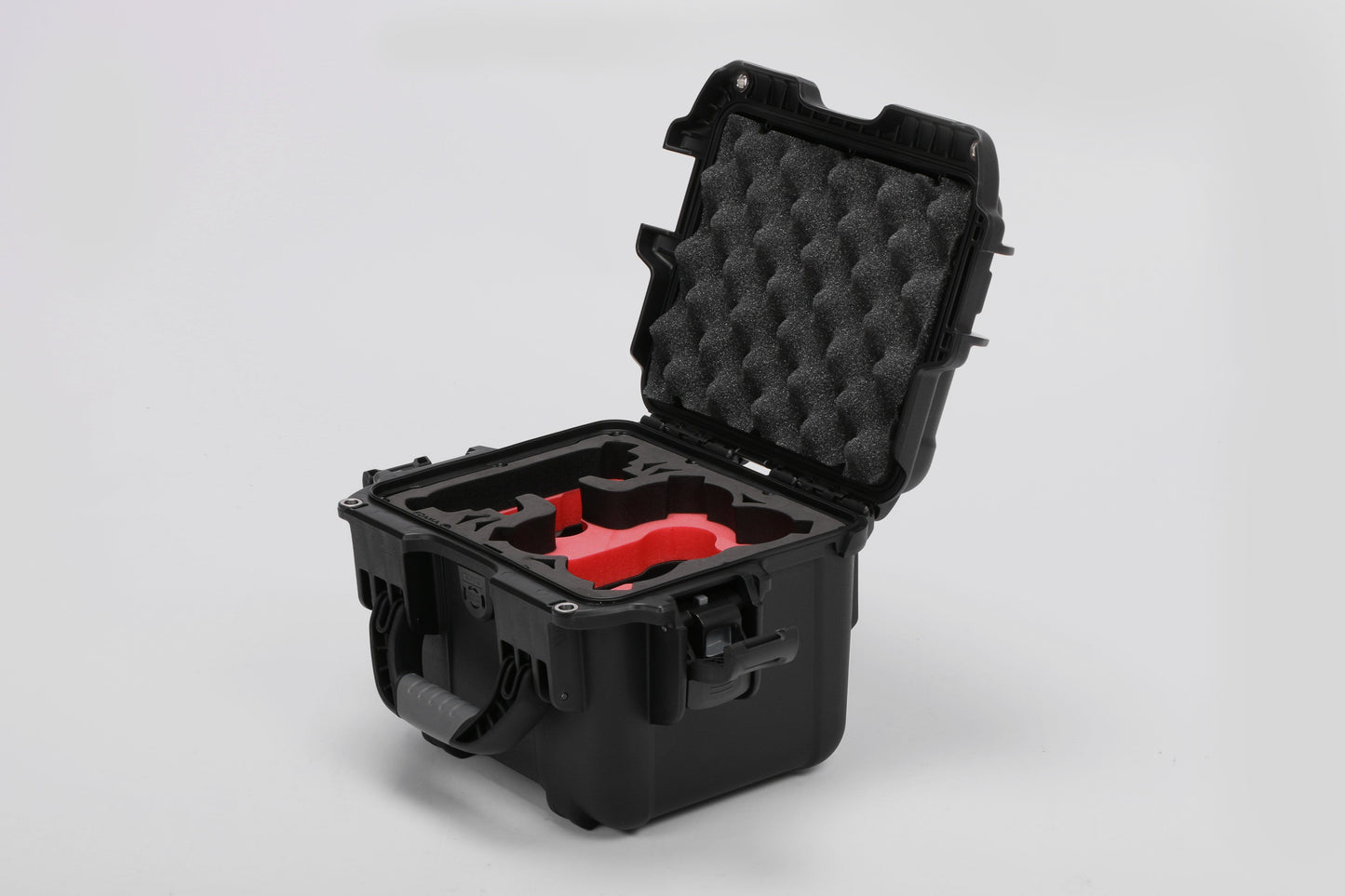 Angled view of DJI Neo Black Color Adventure Ready Compact Waterproof Carry-on Case and Custom Foam Insert with a Red Layer for DJI Neo