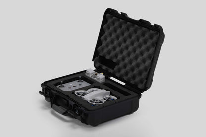 Angled view of Foama black all-weather carry-on case with stylish blue layer insert, holding DJI Neo