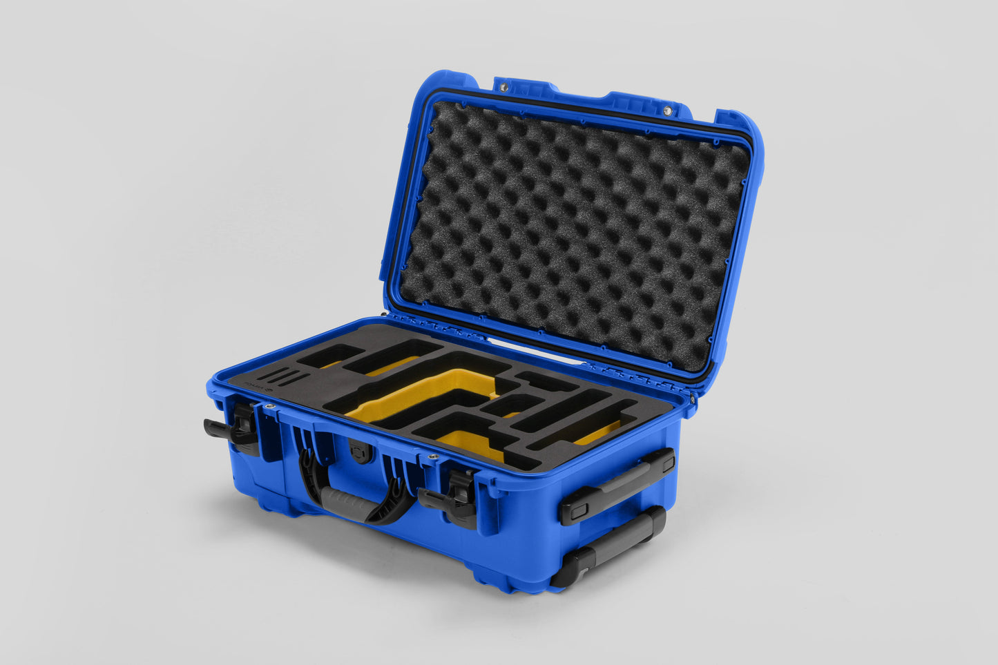 Angled view of Foama Blue Color Travel Case and Custom Foam Insert with Yellow Layer for RED Monstro