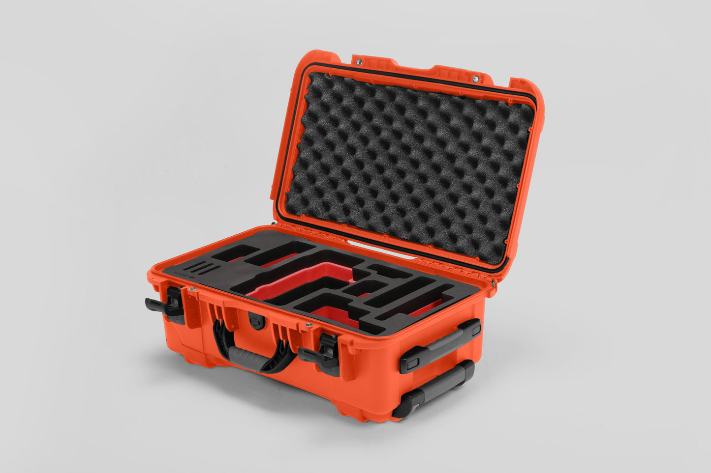 Angled view of Foama Orange Color Travel Case and Custom Foam Insert with Red Layer for RED Monstro