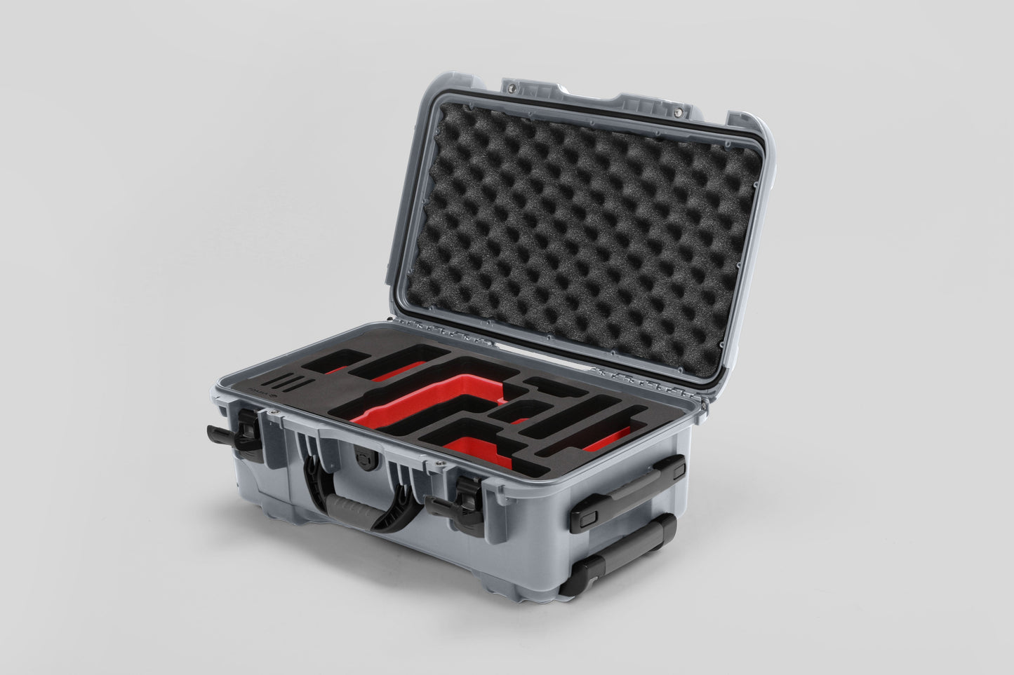 Angled view of Foama Silver Color Travel Case and Custom Foam Insert with Red Layer for RED Monstro