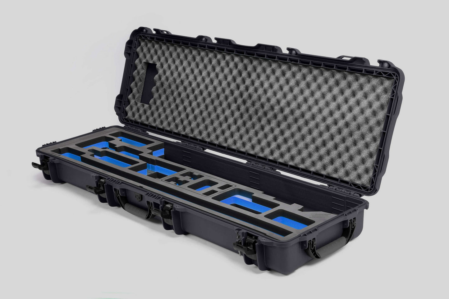 Angled view of Foama Fortified Graphite Color Hard Case and Custom Foam Insert with Blue Layer for DJI D-RTK 2 Mobile Station