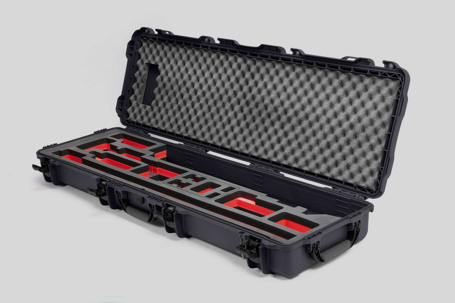 Angled view of Foama Fortified Graphite Color Hard Case and Custom Foam Insert with Red Layer for DJI D-RTK 2 Mobile Station