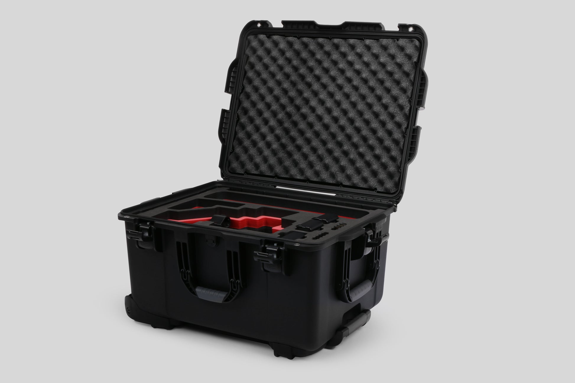 Angled view of Sony FX6 and accessories in Black Color Studio Case and Custom Foam Insert with a Red Layer