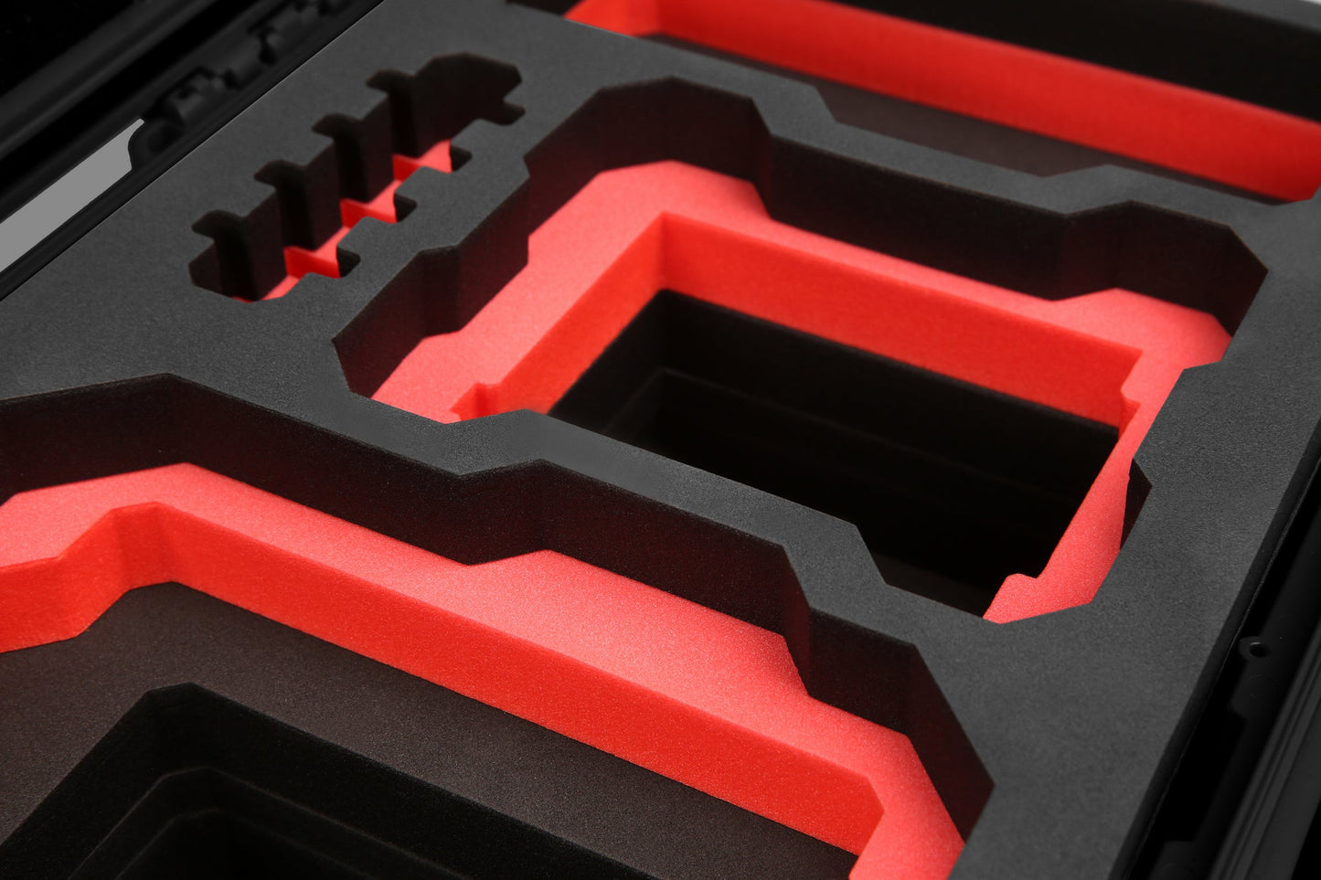Close-up view 1 of Foama Black Color Carry-on case and Custom Foam Insert with Red Layer for RED Komodo-X