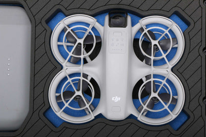 Close up view 2 of Foama black all-weather carry-on case with stylish blue layer insert, holding DJI Neo
