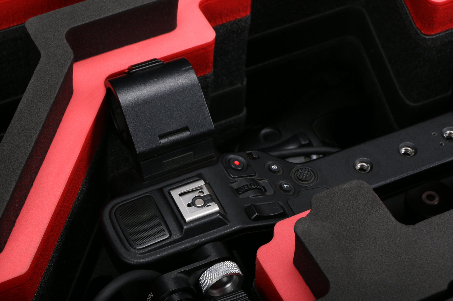 Close-up view 2 of Sony FX6 and accessories in Black Color Studio Case and Custom Foam Insert with a Red Layer